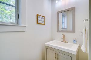 a white bathroom with a sink and a mirror at Paddle, Swim and Hike Family Lake House in Vermont in Wallingford +23 photos