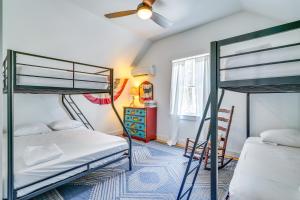 a bedroom with two bunk beds and a window at Paddle, Swim and Hike Family Lake House in Vermont in Wallingford