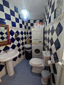 a bathroom with a toilet and a sink at Casa Due Amori in Montilla +44 photos