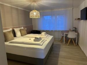 Postel nebo postele na pokoji v ubytování FRISIA NORDD Norddeich + 5 fotografií