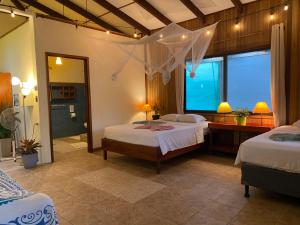 Ένα ή περισσότερα κρεβάτια σε δωμάτιο στο Pura Vida Boutique Apartments