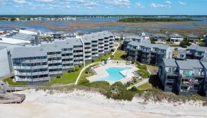 an aerial view of a resort on the beach at Pelican's Post -Ocean, Pool Views, Private Balcony in North Topsail Beach