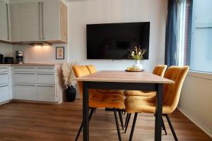 Kuchyň nebo kuchyňský kout v ubytování Ferienwohnung Meerzeit-Hooksiel