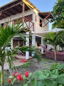 a house with a garden in front of it at Casa del Mar - El Zanate in Las Peñitas