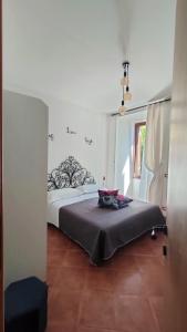 Postel nebo postele na pokoji v ubytování L'Arco nel Borgo