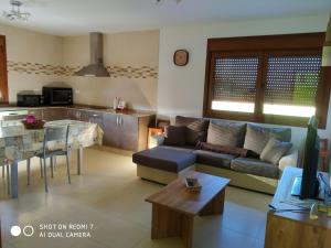 a living room with a couch and a table at Casa Pura in Ribadeo