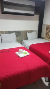 Postel nebo postele na pokoji v ubytování HOTEL EL SOL