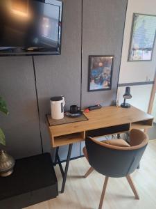 TV a/nebo společenská místnost v ubytování WOB Hotel