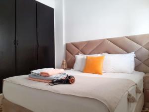 En eller flere senge i et værelse på Appartement Proche Plage avec Parking & Wi-Fi