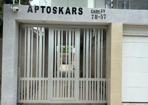 a garage door with a gate in front of a building at Apartamentos KARS in Ríohacha