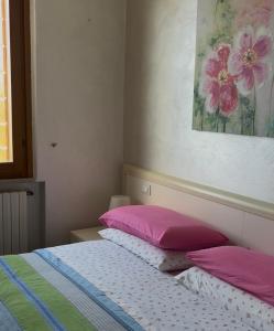 A bed or beds in a room at Agriturismo Nonna Bettina