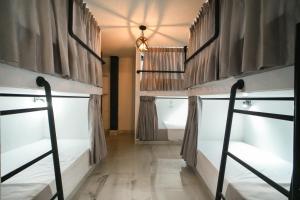 Ένα ή περισσότερα κρεβάτια σε δωμάτιο στο Qantic Lodging & Rooftop