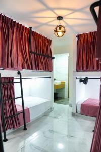 Ένα ή περισσότερα κρεβάτια σε δωμάτιο στο Qantic Lodging & Rooftop
