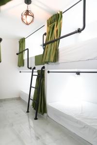 Ένα ή περισσότερα κρεβάτια σε δωμάτιο στο Qantic Lodging & Rooftop