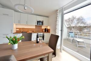 Kuchyň nebo kuchyňský kout v ubytování Ferienwohnung Strandkorb