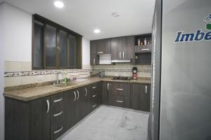 Η κουζίνα ή μικρή κουζίνα στο Qantic Lodging & Rooftop