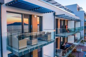 a balcony of a house with a view of the water at Sunset Resort 217 in Fonyód