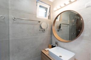 a bathroom with a sink and a mirror at Sunset Resort 217 in Fonyód