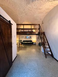 a hallway with a staircase in a room at Dimora n 9 in Locorotondo