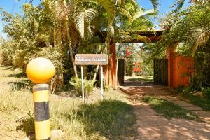 a street sign in front of a house at CHACARA HORTOLAN in Mairinque
