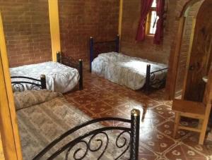 Postel nebo postele na pokoji v ubytování Shambala SPA Medicinal y Retiros