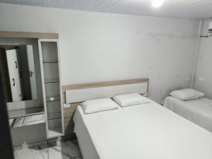 Postel nebo postele na pokoji v ubytování Apartamentos Rio Parana