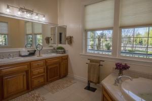 a bathroom with two sinks and a large mirror at ONX WINES - Clark House & Apartment in Templeton +57 photos