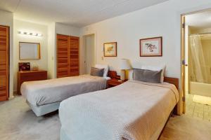 a hotel room with two beds and a window at Snow Tree 337H in Dover