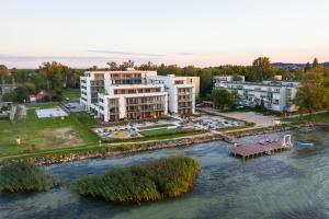 an aerial view of a building next to a river at Sunset Resort 103 in Fonyód