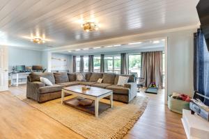 a living room with a couch and a table at Pet-Friendly Paradise with Private Dock in Lexington in Lexington
