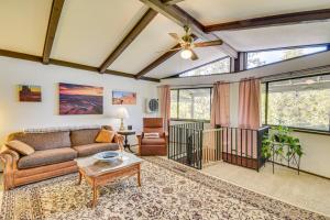 a living room with a couch and a table at Peaceful Groveland Home with Deck and Fire Pit! in Groveland