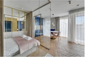 Posteľ alebo postele v izbe v ubytovaní Prestige Apart Gdańsk