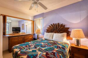 a bedroom with a large bed and a sink at La Costa Villa 2 Depto 202 in San José del Cabo +18 photos