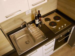 a small kitchen with a sink and a stove at Residence Frascati in Frascati +24 photos