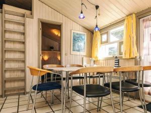 a dining room with a table and chairs at Secluded Pool Retreat - By Traum Ferienwohnungen in Skram