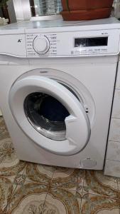 a white washing machine with its door open at Entire apartment centro ponferrada in Ponferrada