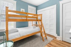 a bunk bed in a room with blue walls at The Hemlock - 1 Hollow in Cherry Valley +63 photos