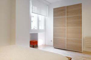 Łóżko lub łóżka w pokoju w obiekcie Ambrosse by FeelFree Rentals