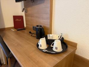 Příslušenství pro přípravu čaje a kávy v ubytování Hotel Schweizerblick