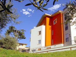 a building with an orange and white at Residence Frascati in Frascati
