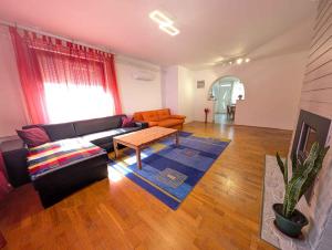 a living room with a couch and a coffee table at Apartment in Siofok - Balaton 54329 in Siófok