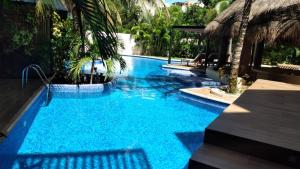 Kolam renang di atau dekat dengan Casa de lujo Ka'an Maya acceso SwimUp a la piscina