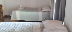 Postel nebo postele na pokoji v ubytování Hotel Maguey