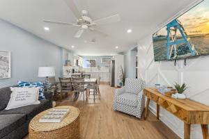 a living room with a couch and a table at North Wind Motel in North Wildwood