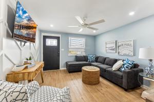 a living room with a couch and a table at North Wind Motel in North Wildwood