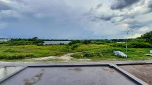a view of a field with a street light at Homestay Ipoh Maziah in Ipoh