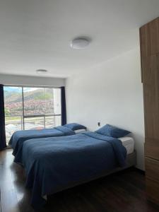 Кровать или кровати в номере Residencial Privada Elegante