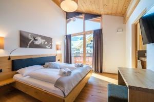 Posteľ alebo postele v izbe v ubytovaní Landal Resort Maria Alm
