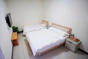 Postel nebo postele na pokoji v ubytování 芹壁五家村民宿
