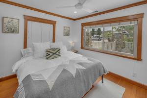 a bedroom with a large bed and a window at Near All Things SD - Canyonview - Jacuzzi - EV Charge in San Diego